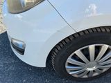 a close up of a car ' s tire on the pavement