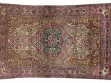 an antique rug with a medallion design on a pink background
