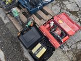 many tools that are sitting on a pallet on the ground