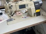 a sewing machine sitting on a table in a room