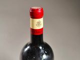 a bottle of wine that is sitting on a table
