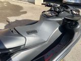 a motor scooter that is parked in the parking lot