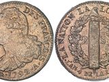 a close up of a coin with an image of a woman on it