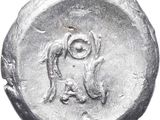 a silver coin with a man and a dog on it