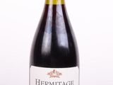 a bottle of wine that is sitting on a table