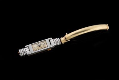 an image of a gold and silver watch on a black background