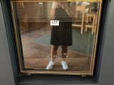 a reflection of a woman in a dress in a mirror