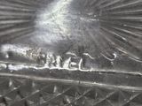 a close up of a metal object with a bird on it