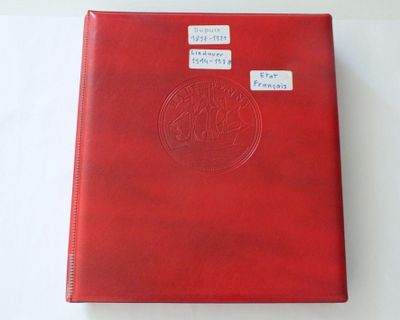 a red book with stickers on it sitting on a table