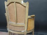 an old wooden chair with a cane back and a cane seat