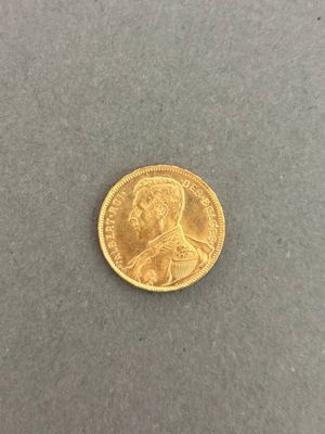 a gold coin with a portrait of a man on it