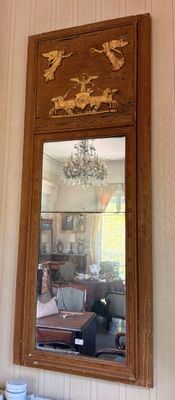 a mirror hanging on the wall of a living room