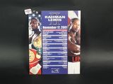 a close up of a poster on a black surface