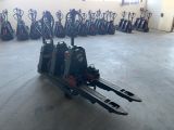 a large group of skis that are parked in a room
