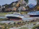 two boats that are sitting on the shore of the water