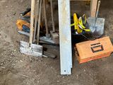 a pile of tools sitting on the ground next to a table