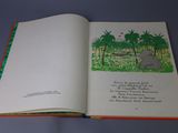 an open book with a picture of an elephant in the jungle