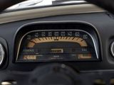 a close up of a car dashboard with a speedometer and gauges