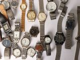 a lot of watches that are sitting on a table
