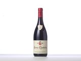 a bottle of red wine sitting on top of a table
