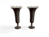 two vases that are sitting next to each other on a table