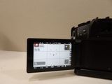 a camera that is sitting on a table next to a monitor