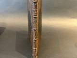 pair of antique brass bookends in the manner of person