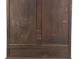 an old wooden cabinet with two doors on a white background