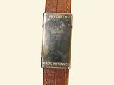 brown leather watch strap with a silver buckle on a white background