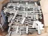 a cardboard box full of metal beams and pieces of wood