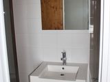 a bathroom with a sink and a mirror in it