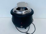 an image of a black electric wax warmer on a white surface