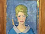 painting of a woman in a blue dress in a wooden frame