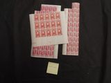 a couple of stamps sitting on top of each other on a table