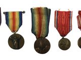 four medals are shown in a row on a white background
