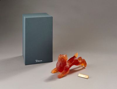a piece of gummy sitting on the ground next to a box