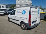 a white van that is parked in a parking lot