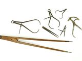 many different tools that are sitting on a white surface