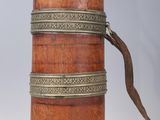 a small wooden box with a strap on it