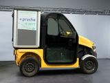 a small yellow and black vehicle parked in a room