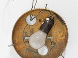 a light that is hanging from a hook on the wall