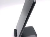 a cell phone that is sitting on top of a stand