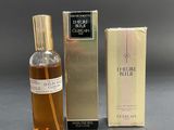an image of a bottle of perfume next to a box of perfume