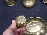 a person that is holding a gold cup in their hand