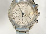 a close up of a silver watch with a white background