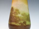 an image of a vase with a landscape painted on it