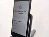 a cell phone that is sitting on a stand