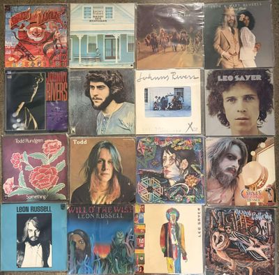 an image of a collection of various album covers on a table