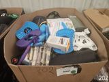 a cardboard box filled with assorted items in a room