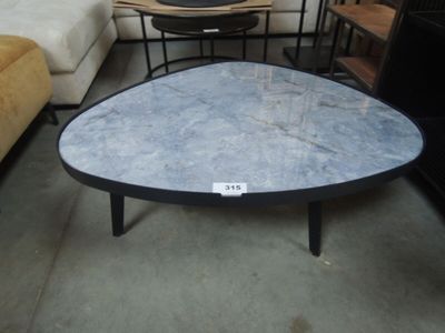 a table that has a blue marble top on it